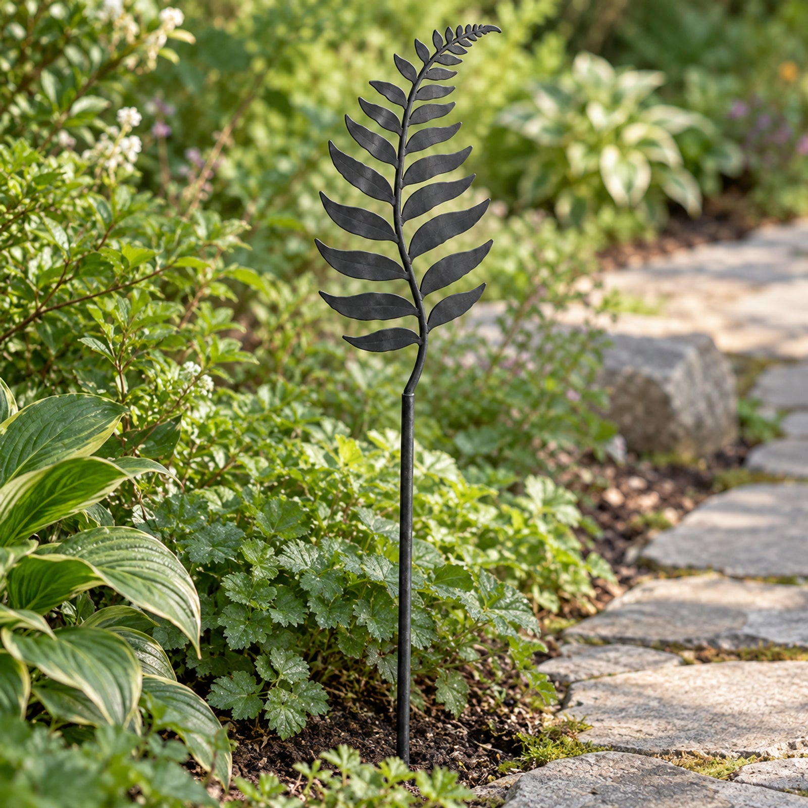 Charcoal fern stake among border planting