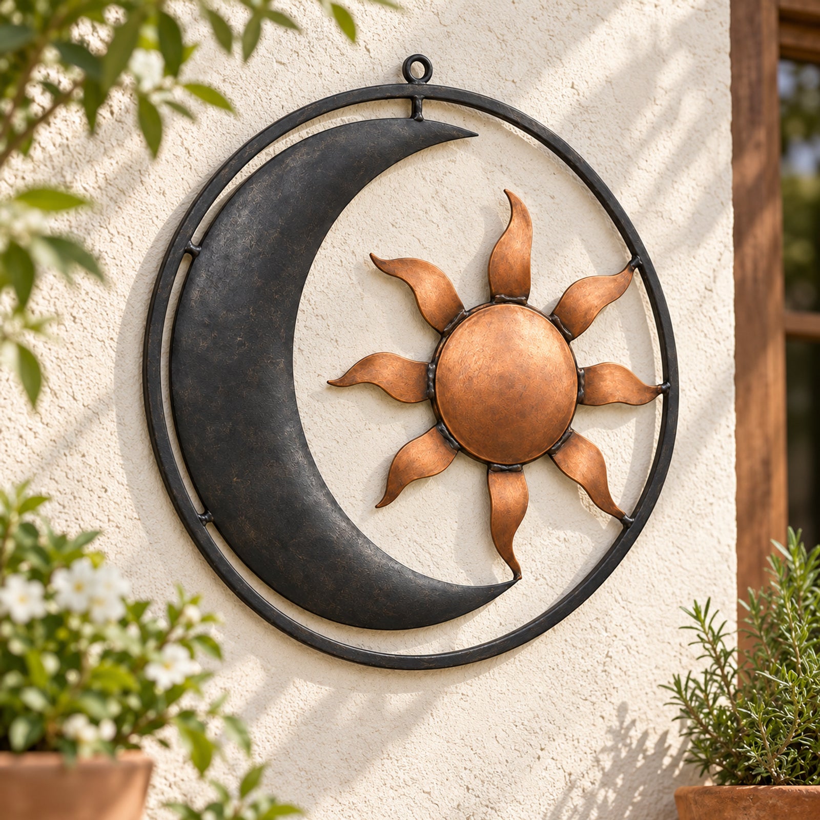 Copper-tone sun and charcoal crescent wall ornament